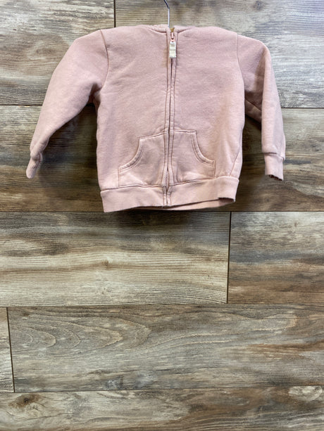 Front view of Carter’s pink full zip jacket in size 18 months showcasing front pockets and ribbed trim on a wood floor