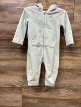 Light gray plush Adidas kids fleece jumpsuit with hood and front pockets on wooden background