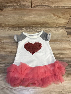 Flat lay of Bonnie Jean sweatshirt dress (grey, 2T) showing red sequin heart and pink ruffled skirt on wood background