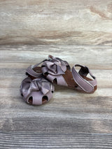 Front and side view of mauve EYY baby sandals, size 5C, showing bow detail and open-toe cutouts on wood-grain background