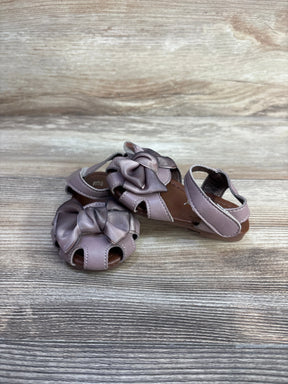 Front and side view of mauve EYY baby sandals, size 5C, showing bow detail and open-toe cutouts on wood-grain background