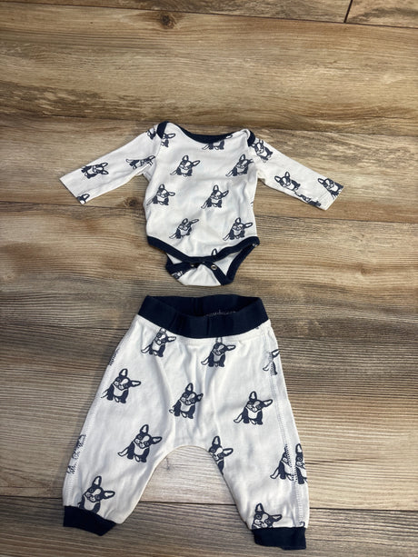 Baby outfit set with dog print, long sleeve bodysuit and pants on wooden background