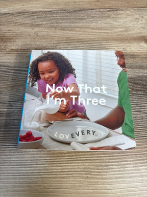 Now That I’m Three children’s book with a smiling child and parent at breakfast table