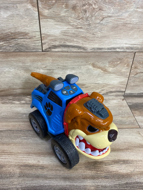 Blue and brown cartoon dog toy car with big teeth and four wheels on wooden floor