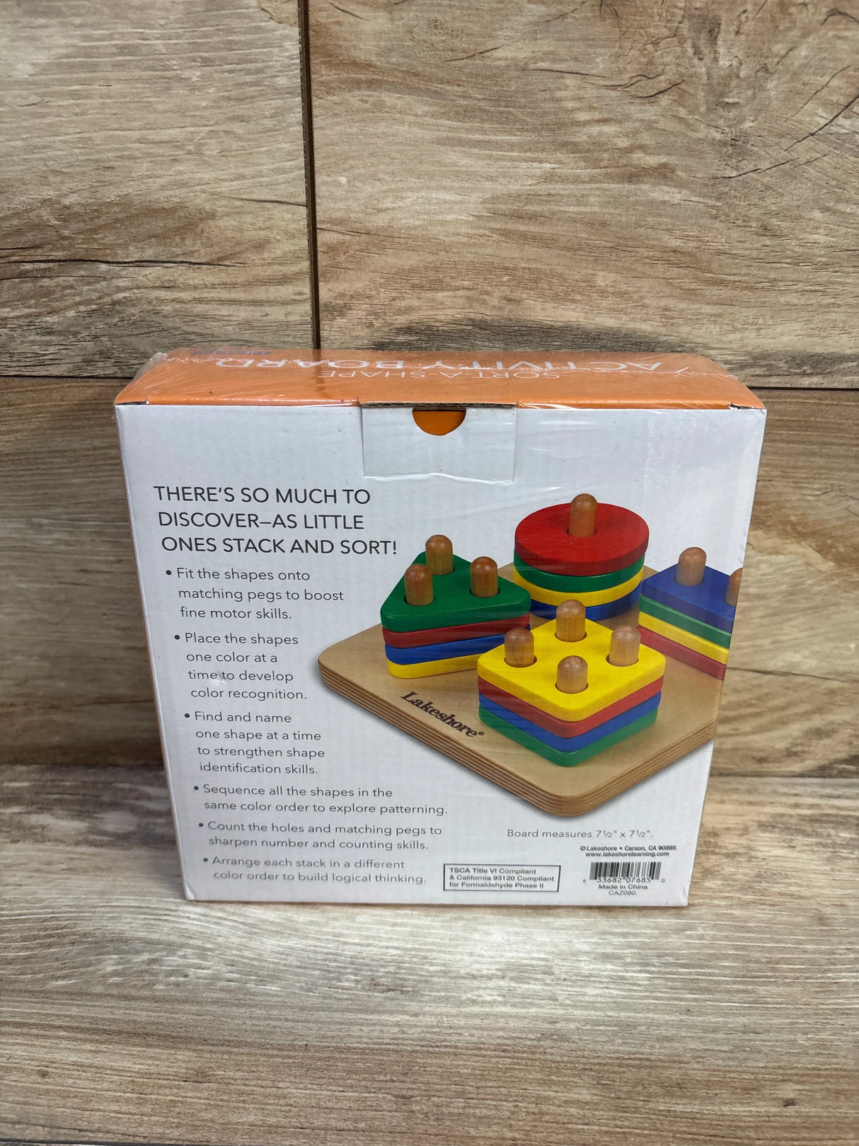 Front of Lakeshore Sort-A-Shape box showing stacked colorful wooden shapes and headline 'There's so much to discover'