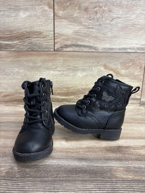 Pair of black toddler boots with butterfly accents on wooden floor, kids shoes resale