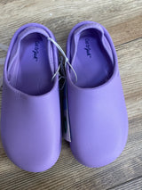 Top-down view of purple Cat & Jack kids' slip-on water shoes showing pair with elastic bungee tie on wood floor