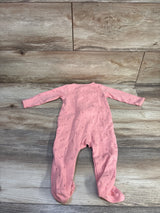 Flat-lay back view of pink Just One You footed sleeper with tiny floral print and long sleeves on wood background