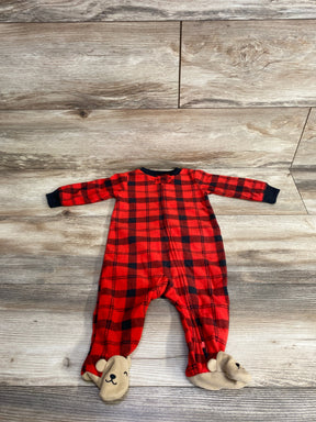 Red plaid baby sleeper with bear face feet on wood floor, cozy kids pajamas