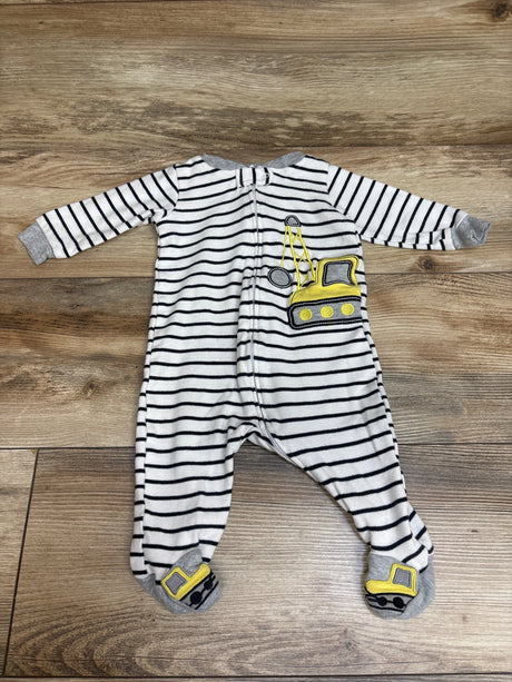 Front view of Koala Baby Sleeper showcasing black stripes and yellow vehicle appliques on a wooden background