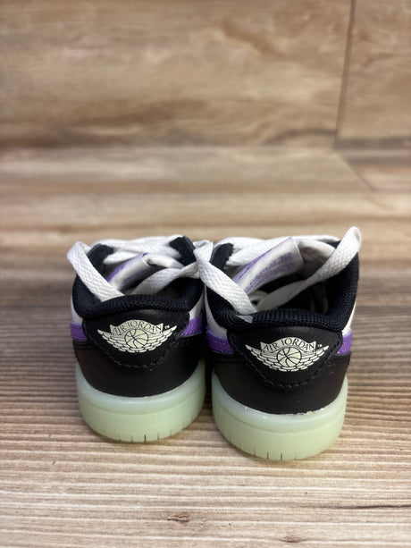 Rear view of Air Jordan 1 Retro Low OG TD Black Raspberry sneakers showing black, white, purple details and translucent soles