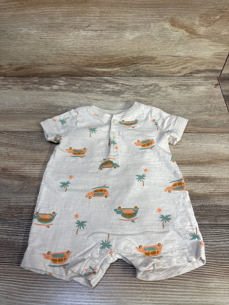 Front flat-lay of ivory baby henley shortie romper showcasing orange and teal car print, front henley button placket and snap crotch on wood background