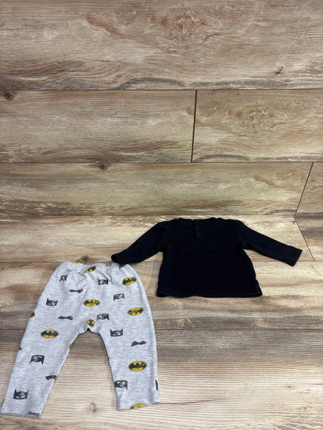 Top view of DC Batman two piece long sleeve shirt and joggers set, black shirt with gray Batman print on wooden floor