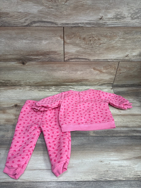 Tahari Baby pink 2-piece quilted sweatshirt and pants set with red heart print on wood background