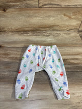 Front flat-lay of grey baby harem pants (3-6M) with elastic waist, cuffed ankles and acorn print on wood