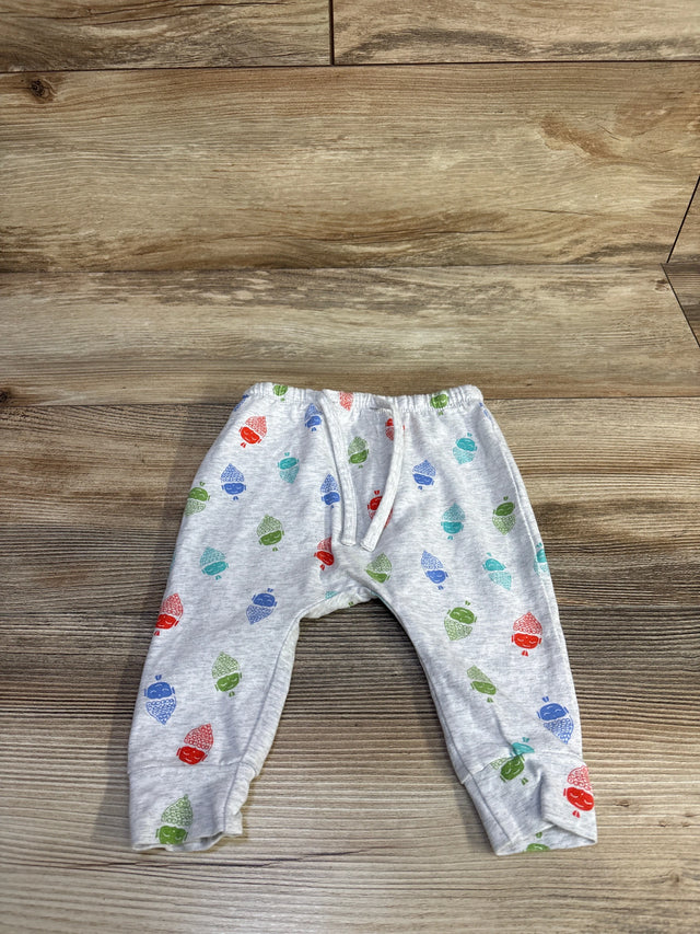 Front flat-lay of grey baby harem pants (3-6M) with elastic waist, cuffed ankles and acorn print on wood