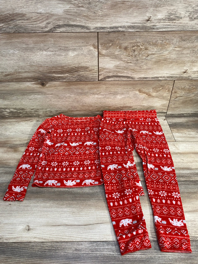 Red holiday kids pajama set with polar bears and snowflakes on wood floor