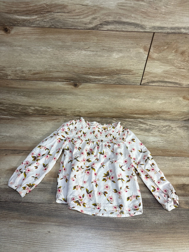 White floral long sleeve baby top with smocked neckline, perfect for kids' spring outfits