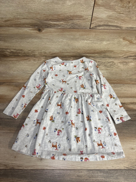 Children's long sleeve gray dress with woodland animal and leaf print on wooden floor