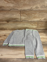 Overhead view of Janie and Jack 2 piece gray sweatshirt and pants set showcasing striped trim on a wood background