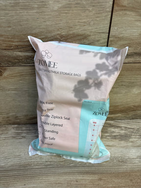 Zomee 120-count breastmilk storage bags package on wood floor, BPA free, freezer safe