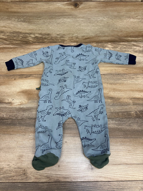 Overhead view of blue Koala Baby Dino Sleeper showcasing dinosaur print, long sleeves, and enclosed feet on wood background