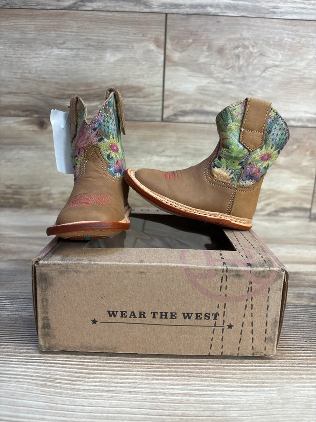 Kids tan cowboy boots with floral cactus print on a box, western style footwear