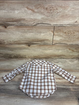 Back view of Wrangler beige plaid western snap toddler shirt, 24m, showing long sleeves, pointed yoke, curved hem on wood