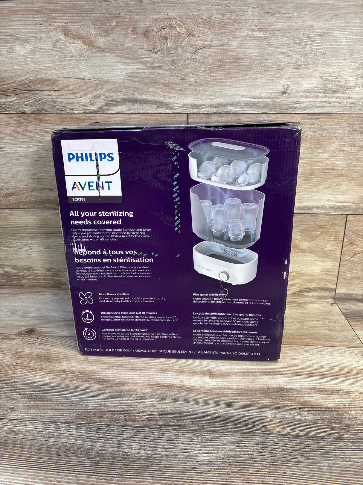 Philips Avent baby bottle sterilizer and dryer in packaging on wooden floor
