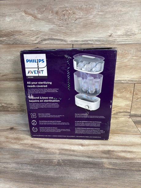 Philips Avent baby bottle sterilizer and dryer in packaging on wooden floor