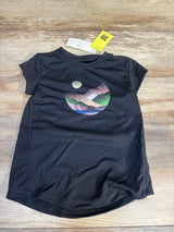 Flat-lay of 4T black short-sleeve active shirt with sparkly mountain-and-moon graphic on wood background, tags attached