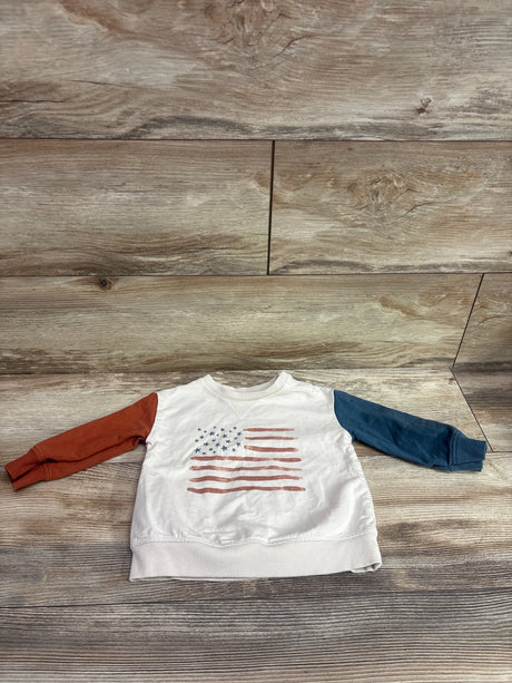 Front view of Little Co. American Flag Pullover Sweatshirt in beige, size 12m, showcasing red and navy sleeves and flag graphic on wood