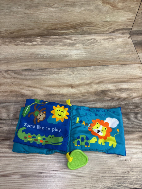Open Jungle Friends Cloth Crinkle Book with Teether showcasing animal illustrations and green teether on wood surface