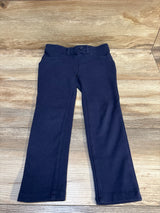 Top-down view of Children's Place navy ponte knit pull-on jeggings (size 5T) showcasing pull-on waistband and front pockets on a wood floor