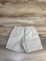 Back view of Polo Ralph Lauren khaki toddler shorts showcasing elastic waistband, size 2T, flat on wood background
