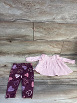 Overhead view of Just Lizzy two piece long sleeve waffle knit peplum top and heart pattern pants set on wood flooring