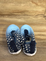 Top-front view of Fires Barefoot blue quick-dry toddler water shoes showing perforated upper, bungee laces, and white sole on wood background