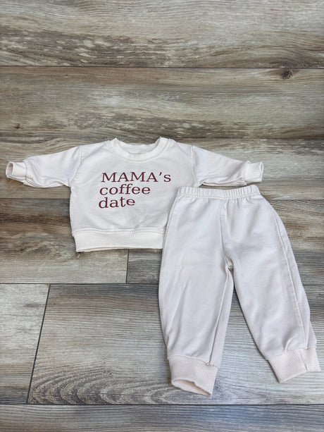 Top view of cream MiniOlie sweatshirt set with matching pants and Mama’s coffee date text on wood background