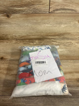 Top view of 10-pack potty training underwear, size 5T, double absorbency, in a clear bag showing colorful prints on a wood background