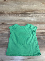 Flat-lay back view of Children's Place green short-sleeve toddler tee, size 2T, on wood plank background