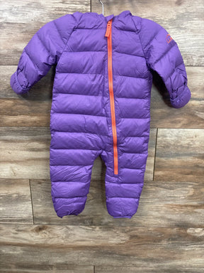 Purple puffer infant one-piece snowsuit with orange zipper hanging on wooden background