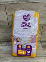 Front of Parent's Choice Dry & Gentle diapers pack, Size 1 (44 ct) with purple and yellow packaging and baby image on wooden floor