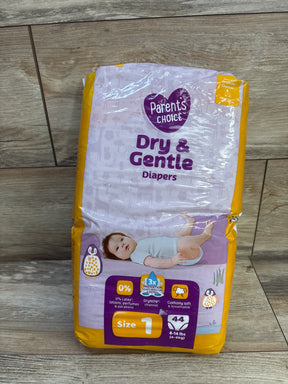 Front of Parent's Choice Dry & Gentle diapers pack, Size 1 (44 ct) with purple and yellow packaging and baby image on wooden floor