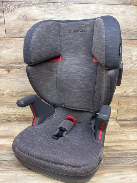 Front view of UPPAbaby Alta V2 High Back Booster Car Seat in Greyson showcasing padded armrests on wood plank background