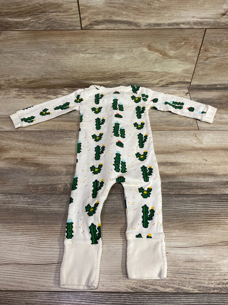 Flat lay of M A by Monica and Andy Cactus Sleeper in beige with cactus print, long sleeves, and footed legs