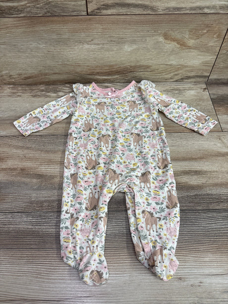 Front view of an ivory bamboo baby coverall, size 3m, with long sleeves and horse and pig floral print on wood grain