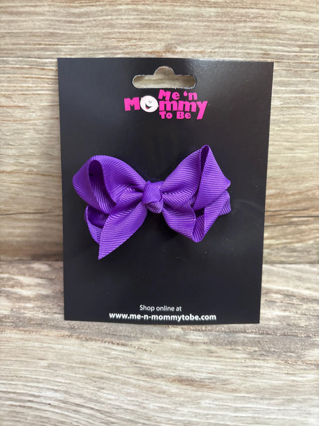 Solid purple grosgrain hair bow attached to a Me n Mommy To Be branded display card.