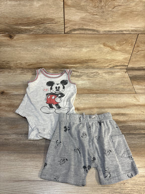 Gray baby romper and shorts set with Mickey Mouse print on wood background