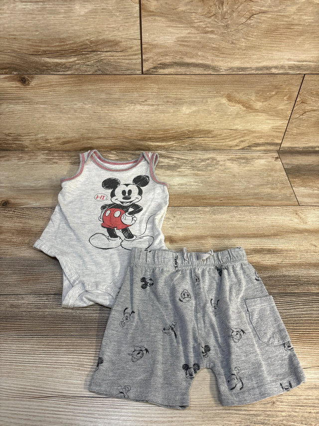 Gray baby romper and shorts set with Mickey Mouse print on wood background