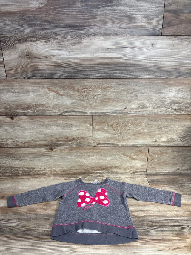 Gray toddler sweatshirt with pink polka dot bow design, displayed on wood floor background